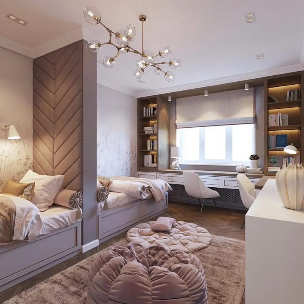 Guest bedroom office combo with twin beds, chevron headboards, built-in shelves, and a shared desk under a large window.