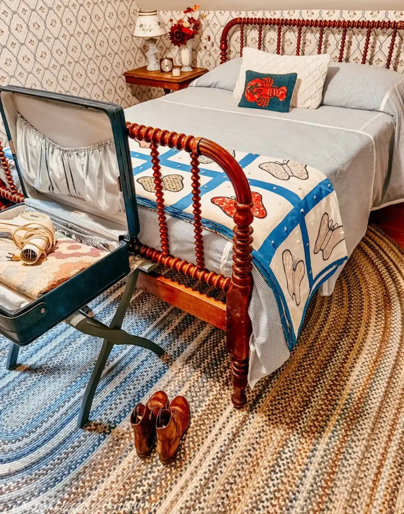 bedding with vintage quilt, spindled wooden bed, and nostalgic decor.
