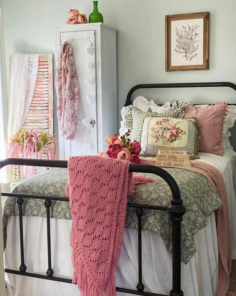floral pillows, crochet throw, and iron bed frame.