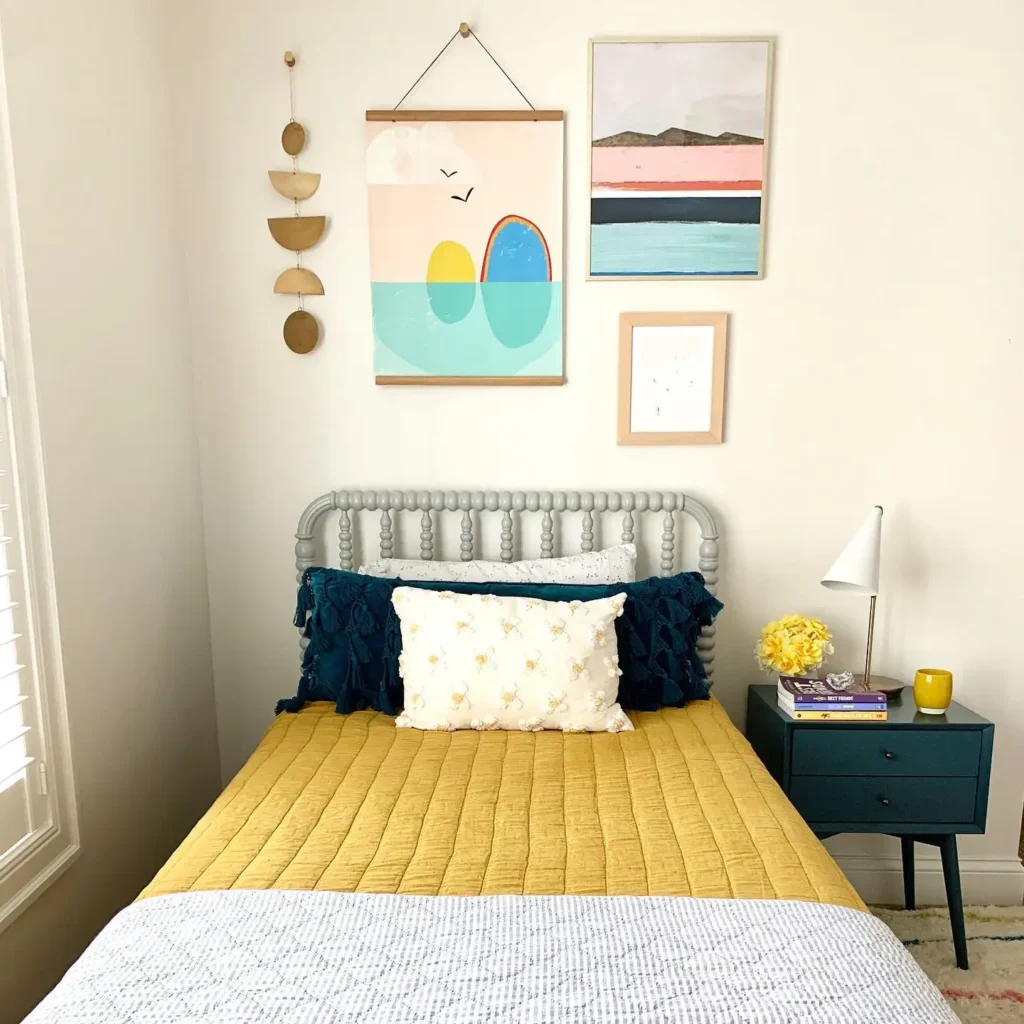Preteen girls bedroom with mustard bedding, teal accents, colorful wall art, and a modern nightstand.