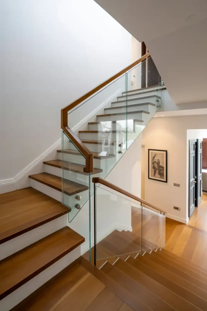 Stairwell with Glass Balustrade and Wooden Treads