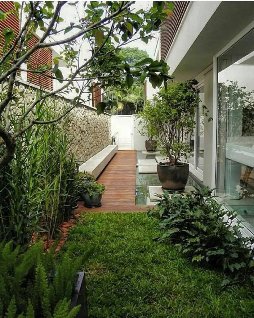 Sleek Urban Garden with Wood Deck and Green Borders
