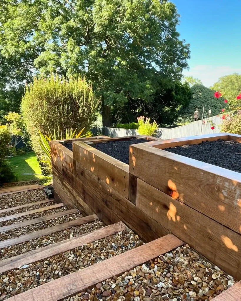 Rustic Timber Retaining Beds with Gravel Pathway