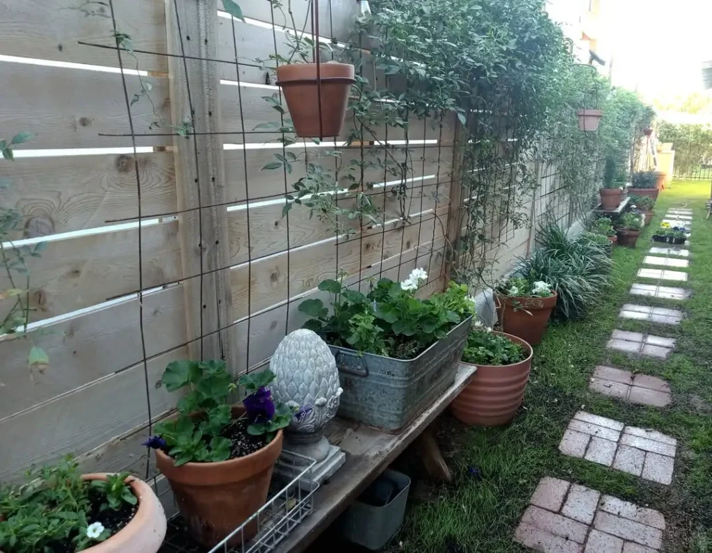 Rustic Fence Garden with Layered Planters